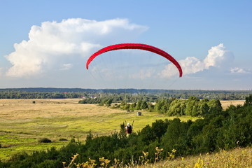 paraglider soar in the air amid wondrous landscape