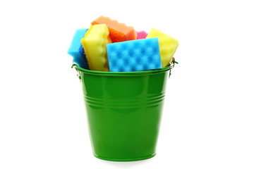 Bucket with colored sponges for cleaning.