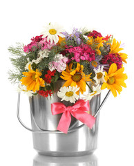 beautiful bouquet of bright  wildflowers in bucket, isolated