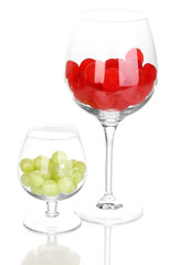 Color candies in glasses isolated on white