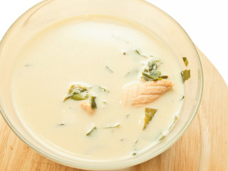 cream soup with salmon and weed over white