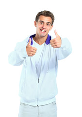 Portrait of a handsome young man, thumbs up