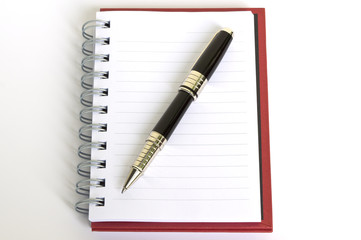 Naklejka premium notebook paper and pen