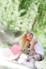 young happy woman enjoying roller skating / blading on natural b