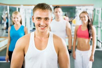 Fototapeta na wymiar Fitness instructor with gym people