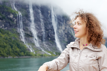 Portrait of woman against Seven Sisters Waterfall