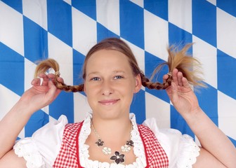pretty woman in dirndl with braided pigtails