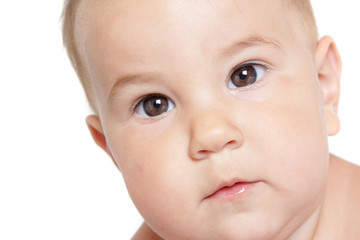 studio close up portrait of cute baby isolated over white backgr