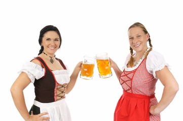 Two young pretty women in dirndl with beer mug