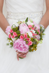 Bride with bouquet, closeup