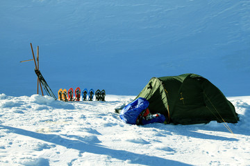 Tent in winter mountains.