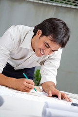 Architect Working On Blueprint