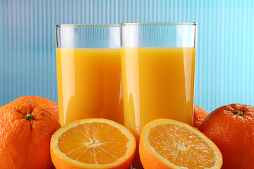 Glasses of orange juice and fruits
