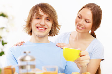 Couple at home drinking tea
