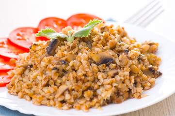Buckwheat porridge with mushrooms on plate