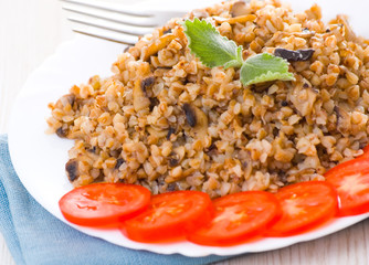Buckwheat porridge with mushrooms on plate
