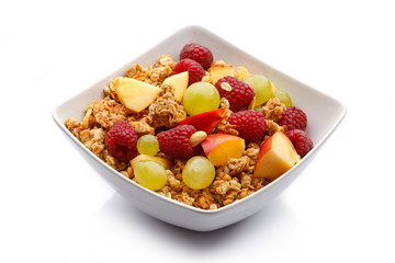 Bowl of muesli on white background
