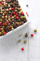 Peppercorn mix on a vintage wooden table