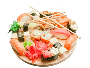 sushi set  and chopsticks on the wooden desk isolated on white