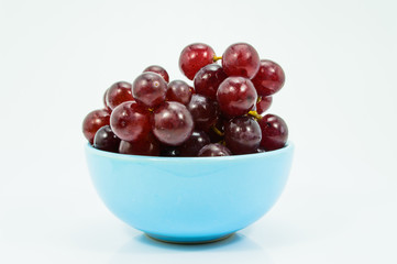 Fresh Grapes in a Blue Ceramic Bowl.
