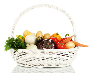 Fresh vegetables in white basket isolated on white