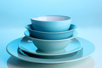Blue tableware on blue background