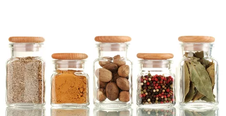Zelfklevend Fotobehang powder spices in glass jars  isolated on white © Africa Studio