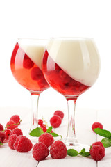fruit jelly with berries in glasses on wooden table