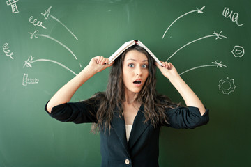 horrified woman over chalkboard