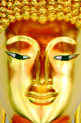 Golden face of Buddha.