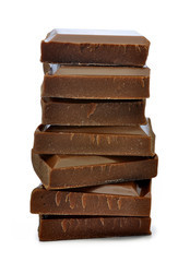 Stack of chocolate pieces on a white background