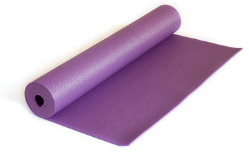 Rolled up yoga mat isolated on white