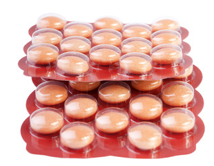 yellow pills in red ambalage