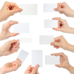 Hands hold business cards on white background