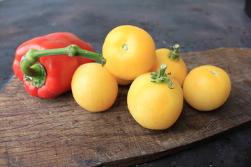 Beautiful yellow tomatoes and red bell pepper