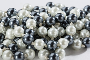 String of black and white pearls