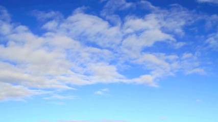 Accelerated blue fluffy cloudscape