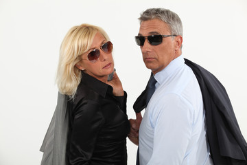 A stylish businesspeople couple.