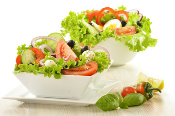 Vegetable salad bowls isolated on white