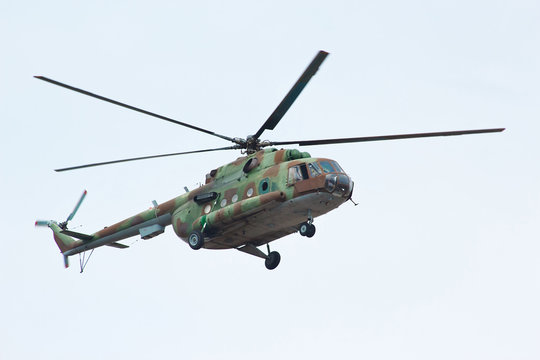 Russian military helicopter MI-8 in the cloudy sky