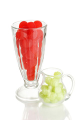 Color candies in glasses isolated on white