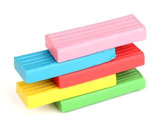 Children bright plasticine isolated on white