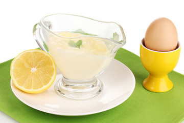 Mayonnaise in bowl on napkin isolated on white