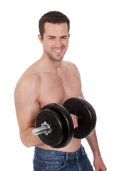 Obraz na płótnie Canvas Young man exercising his biceps