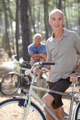 Obraz premium Two older men out for a bike ride