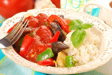 chicken and vegetables in tomato sauce with rice