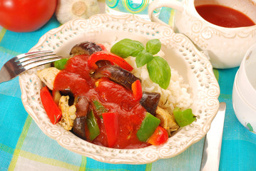 chicken and vegetables in tomato sauce with rice
