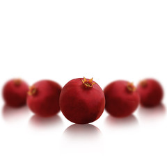 Bright red pomegranates isolated on white background with beauti