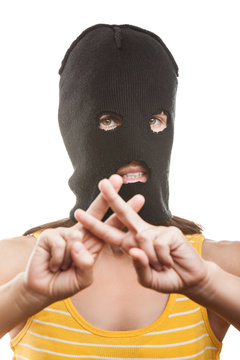 Woman in balaclava showing jail or prison finger gesture