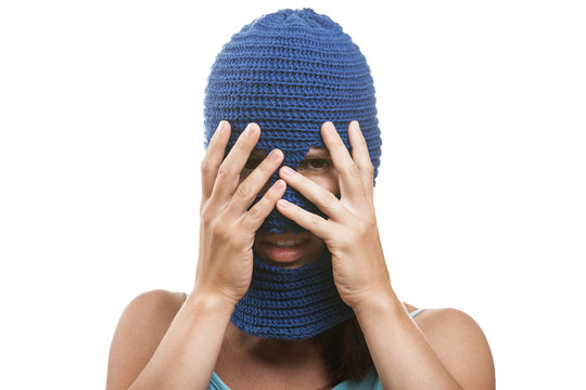Woman in balaclava hiding face